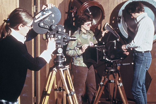 Students work in a television studio, possibly in the basement of Memorial Hall 1976.